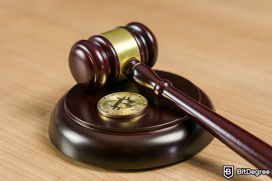 Crypto staking: A Bitcoin token and a gavel.