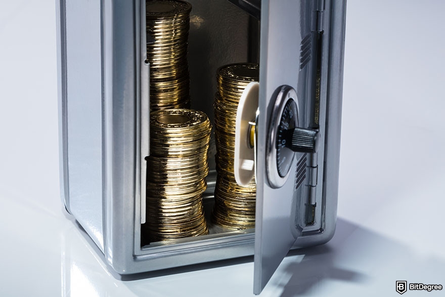 TokoCrypto review: stacks of gold coins inside an open safe.