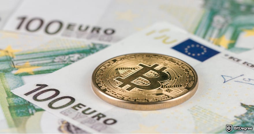 Topper crypto review: a Bitcoin on top of an Euro banknote.