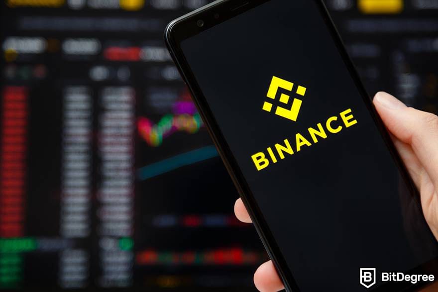 Tron wallet: a phone displaying Binance logo.