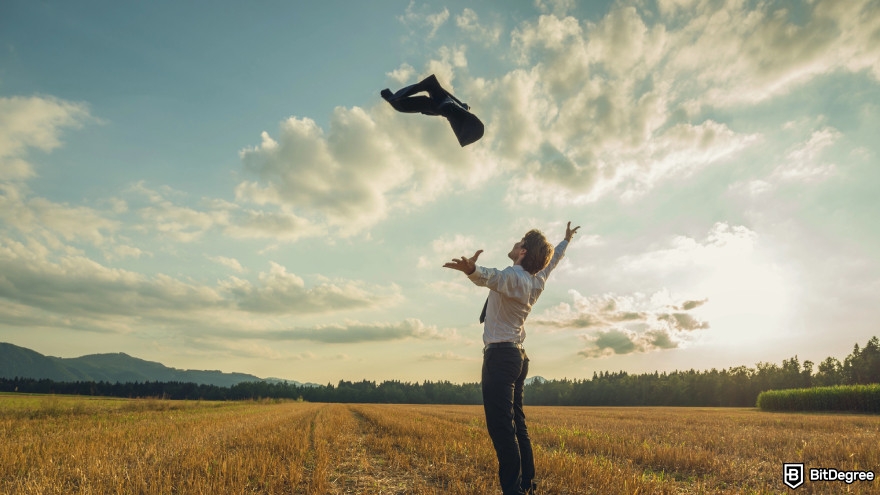 Types of crypto exchanges: joyful man celebrating his success in beautiful evening nature.