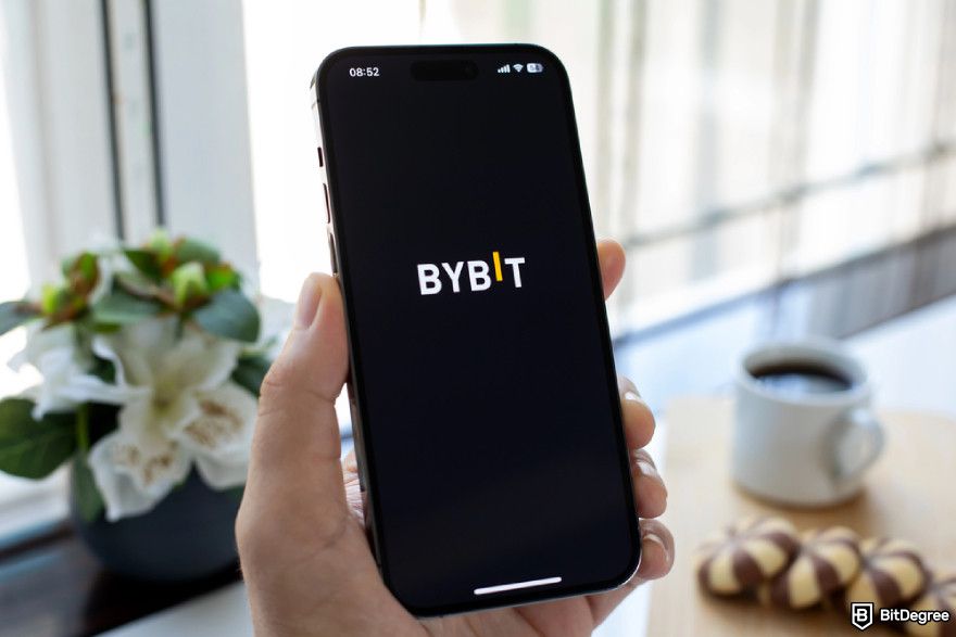 Types of crypto exchanges: Bybit logo on a phone screen.