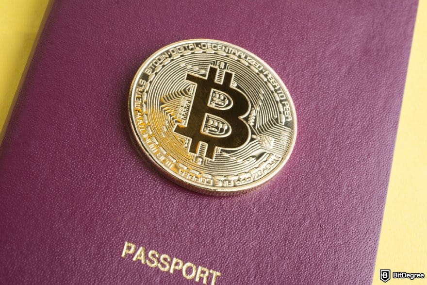Uphold review: a BTC coin on a red passport.