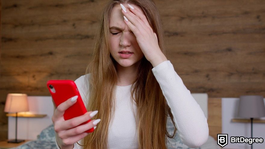 What is AMP crypto?: An upset girl looking at her phone.