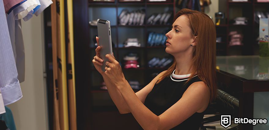 What is digital fashion? A woman uses an iPad to view clothing.