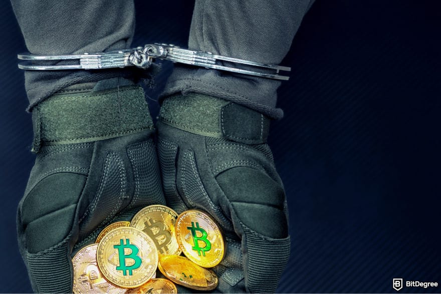 What is double-spending in blockchain: handcuffed hands holding a pile of Bitcoins.