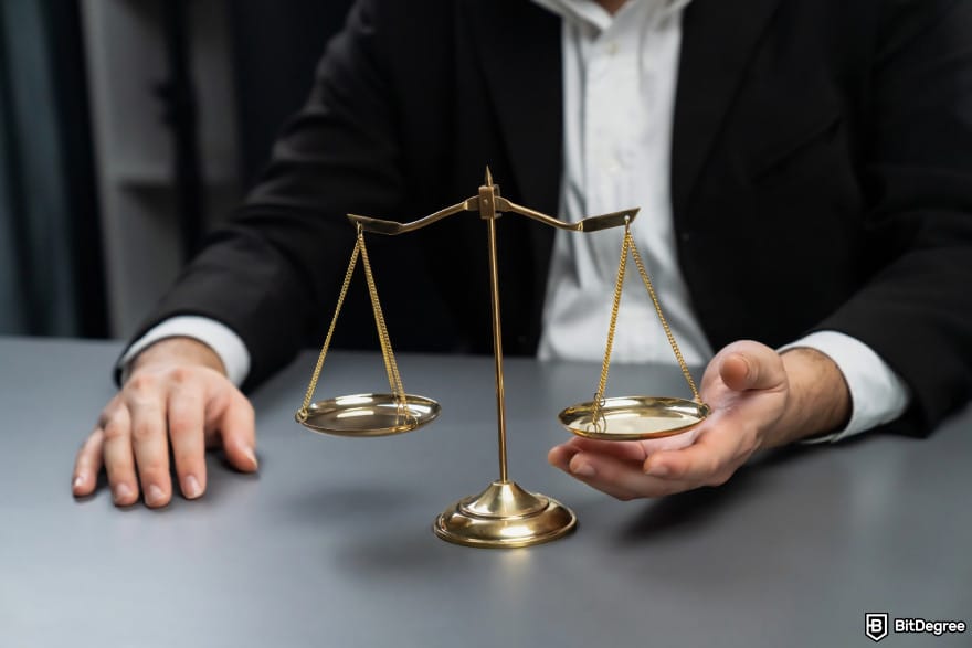 What is double-spending in blockchain: a person balancing a set of gold scales.