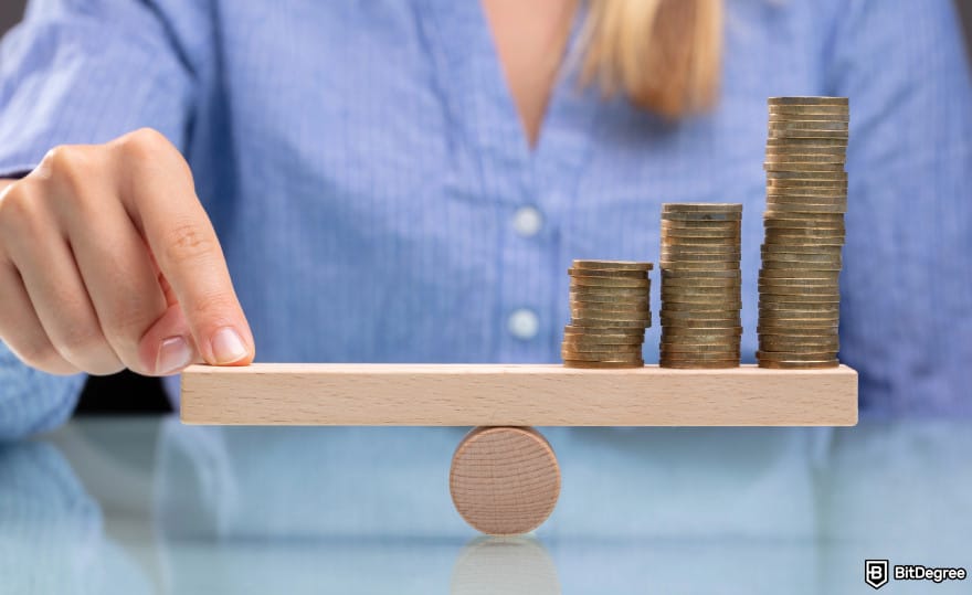 What is double-spending in Blockchain: a person balancing three piles of coins on a bar.
