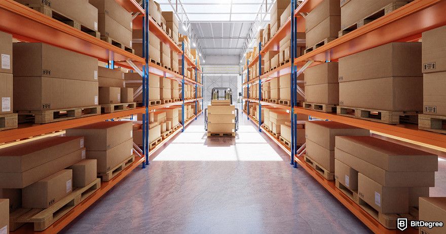 What is Hedera: a forklift carrying a stack of boxes on a pallet down an aisle in a warehouse.