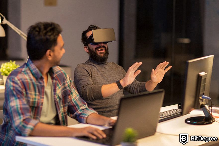 What is Render crypto: a person looking at another person wearing a VR headset.