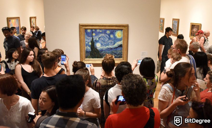 What is RWA in crypto: people taking pictures of "Starry Night" at Van Gogh Museum.