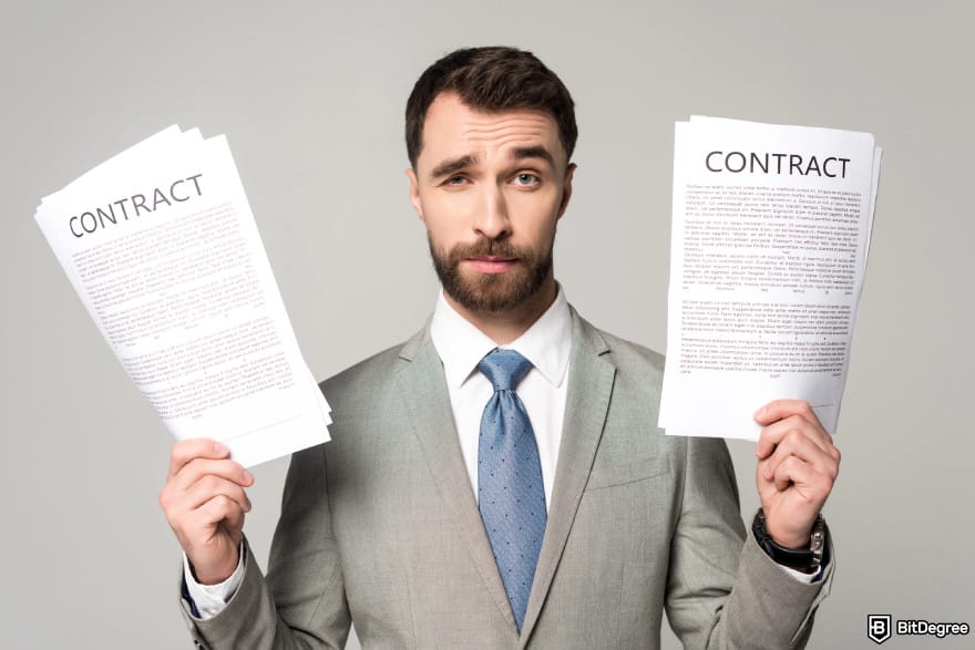 What is xNFT: a man holding contracts in both hands.