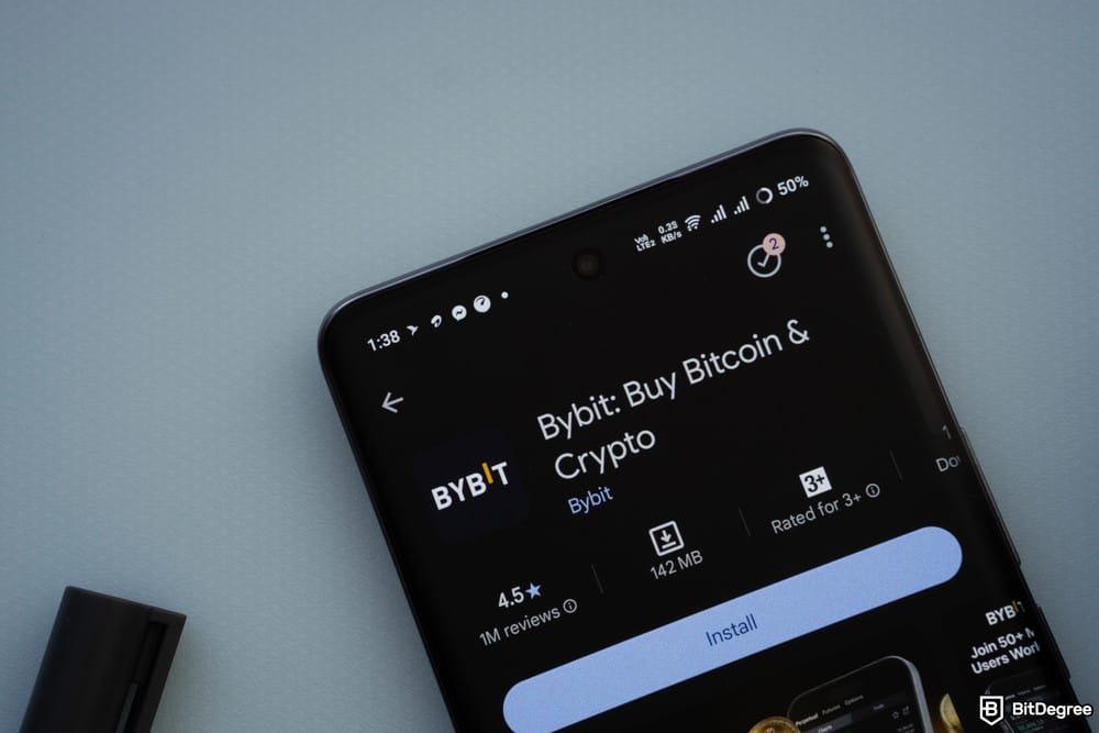 Where to buy VeChain: the Bybit app in Google Play Store displayed on a mobile phone.