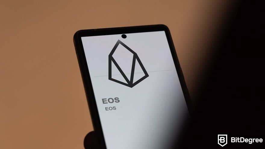 Why is crypto bad for the environment?: A close-up EOS logo on a phone.