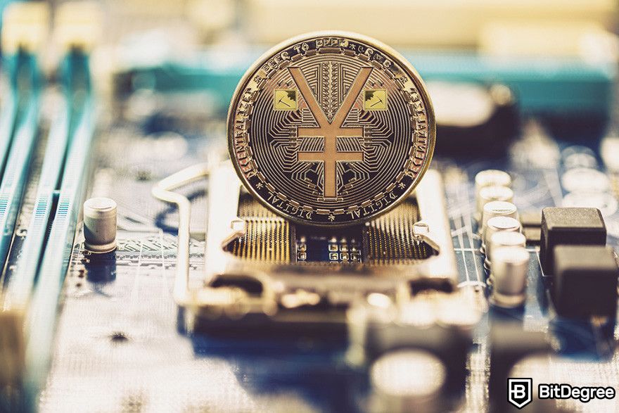 Why crypto is down: a Yuan coin on a PC motherboard.