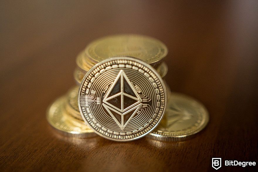 Why is crypto down: a stack of Ethereum coins on a wooden surface.