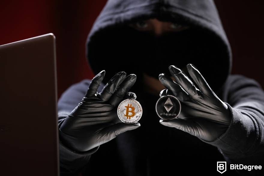 Tiền điện tử sẽ phục hồi: Một hình người mặc áo hoodie đang cầm Bitcoin và Ethereum