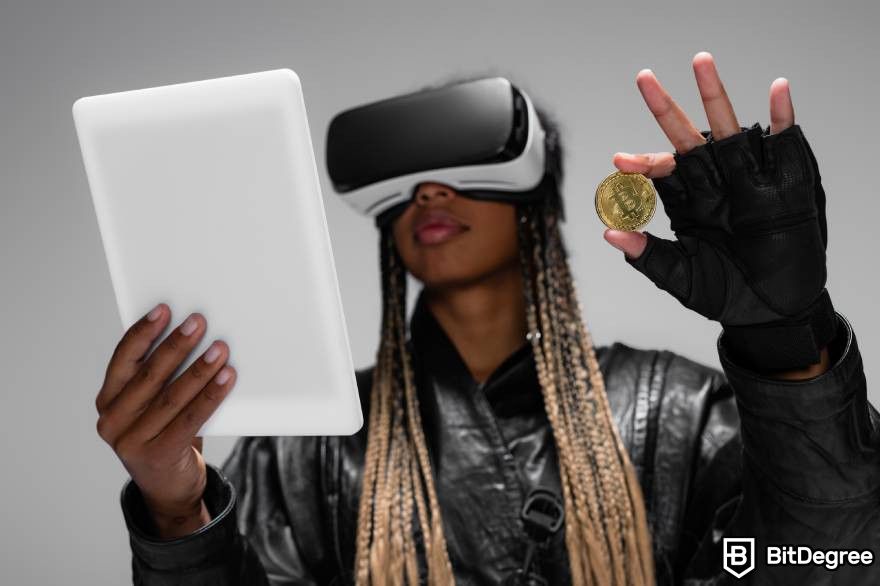 Will crypto recover: A woman in a glove, wearing a virtual device, holding a pad and Bitcoin showing technological innovations