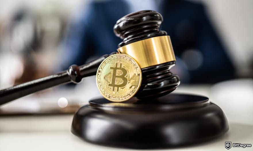 Will Floki Inu reach $1? A gavel with a Bitcoin next to it.