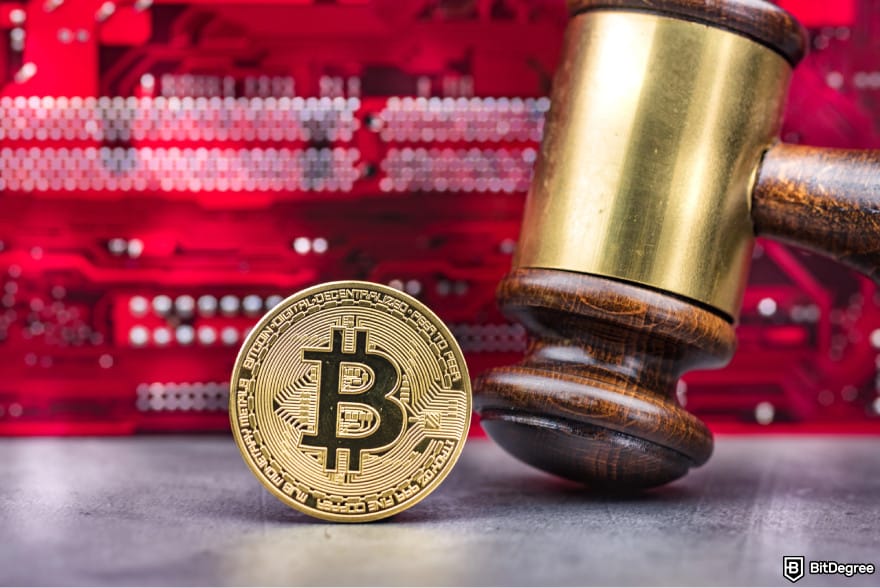 Will Stellar Lumens reach $1: a gavel next to a Bitcoin.