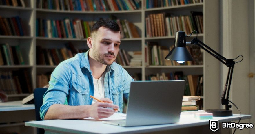 Wordtune review: A man studying on his laptop.