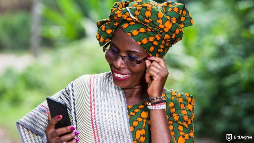 WorldRemit review: close up of young woman with phone. WorldRemit review: close up of young woman with phone.