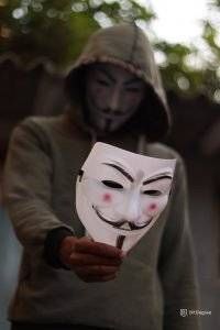 what is cyber security - a person with vendetta mask