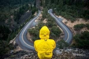 person sitting on mountain