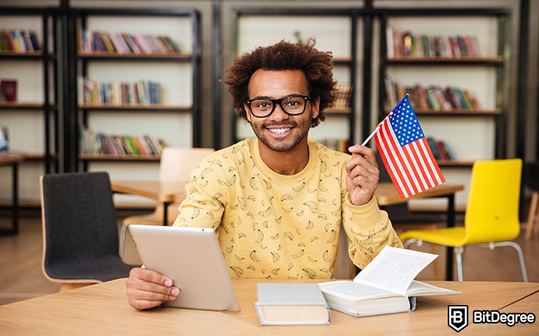 Toefl preparation courses: man holding usa flag