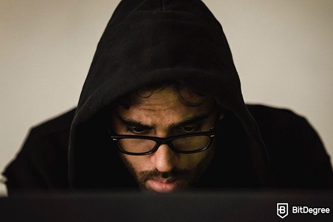 Best online coding courses: a man looking at a computer screen.