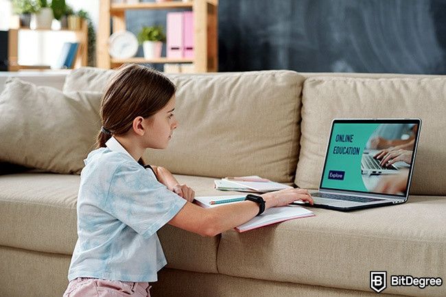 Distance Learning: A girl is using online education tools on her laptop.