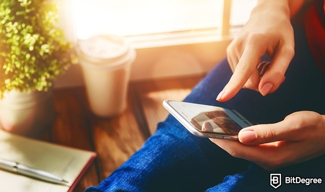 Distance learning: A woman using a phone.