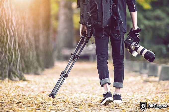 Harvard online photography course: photographer carrying his equipment.