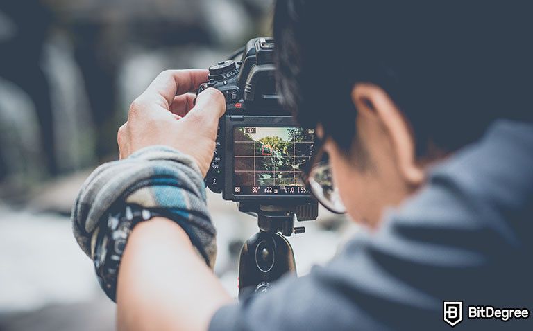 Harvard online photography course: guy taking a picture with a camera.