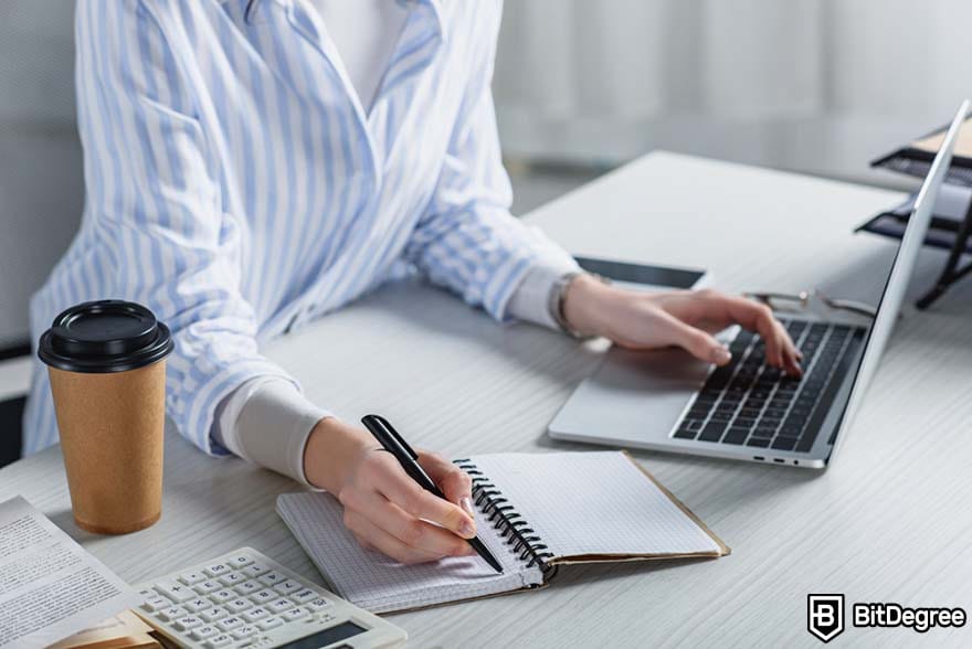 How to become a marketing manager: woman taking notes.