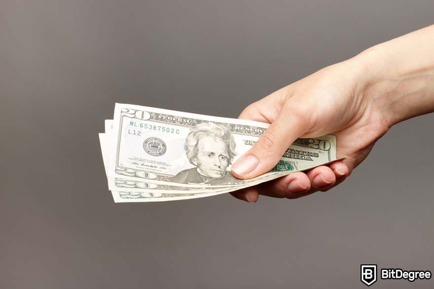 How to become a marketing manager: woman handing money.