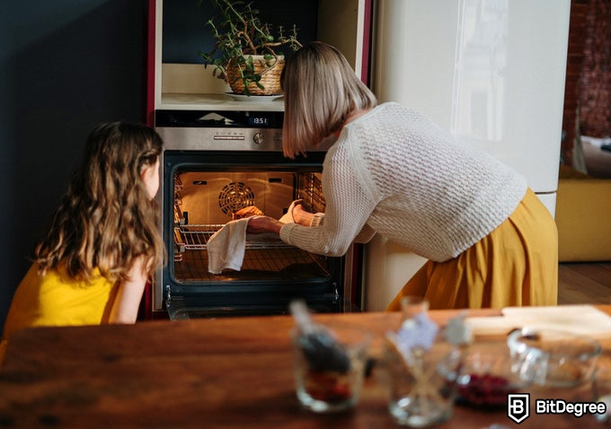 How To Cook: grandma taking food out of the oven.