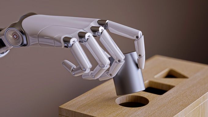 Learning How to Learn Coursera: tangan robot yang sedang memasukkan benda ke dalam kotak.