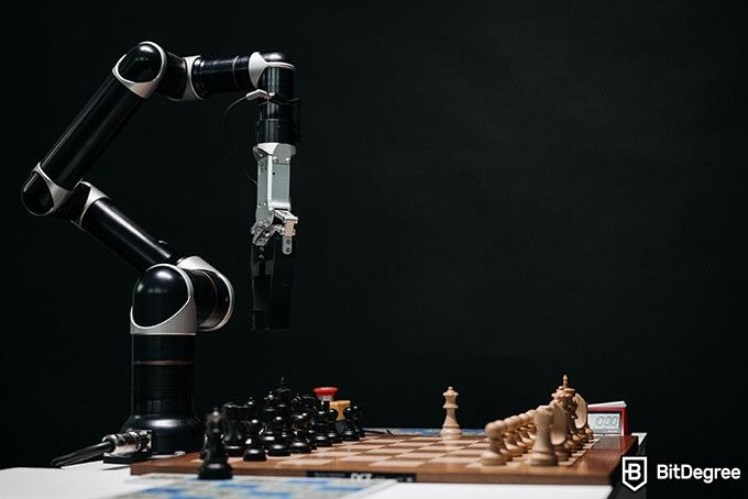 Online Artificial Intelligence Course: robot playing chess.
