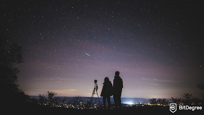 Online astronomy degree: a couple watching the night sky