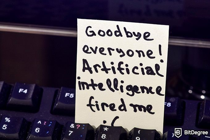 Online ethics courses: A post-it note on a keyboard that reads Goodbye Everyone! Artificial Intelligence Fired Me.
