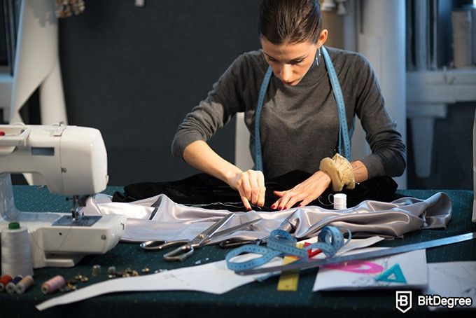 Online Fashion Design Courses: woman sewing a garment.