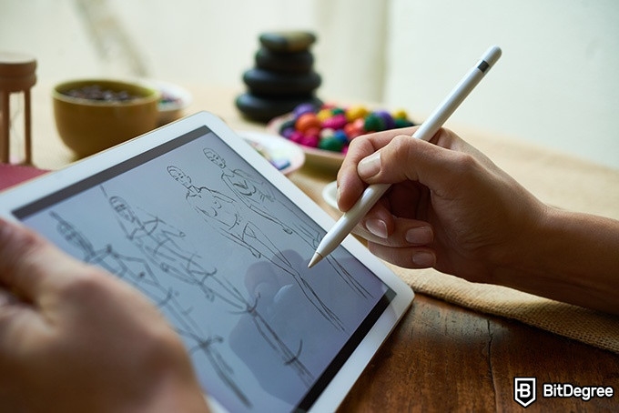 Online Fashion Design Courses: person drawing fashion illustrations on a tablet.