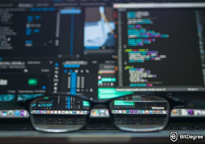 Online Healthcare Degrees: medical software and glasses on a table.