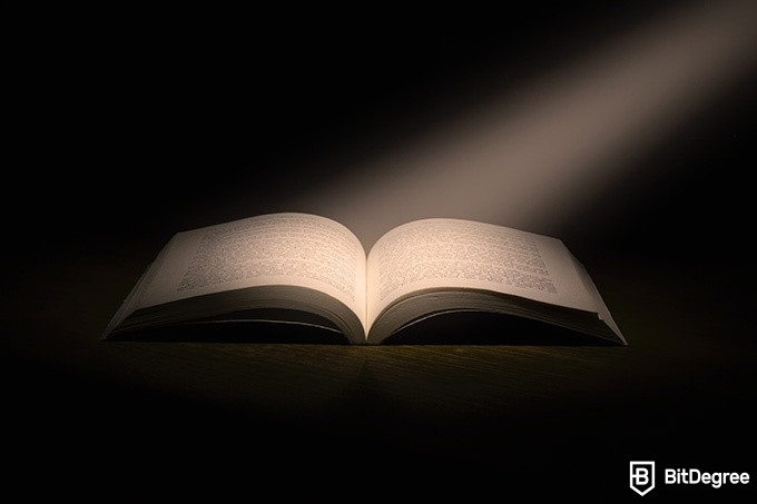 Online literature course: a light shinning on a book.