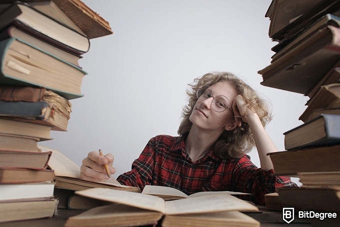 Online literature course: a person surrounded by books.