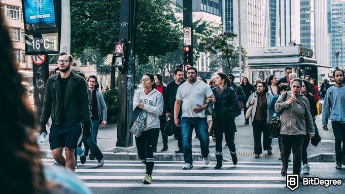 Online public health degree: crowd in a crosswalk