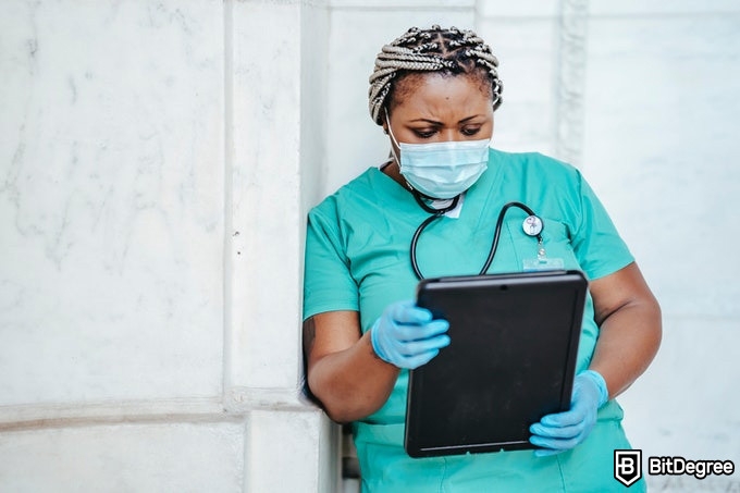 Online public health degree: a health specialist reading a chart