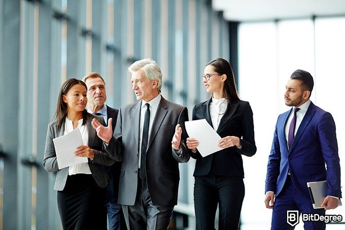 Online social sciences degree: a group of politicians is walking and talking.