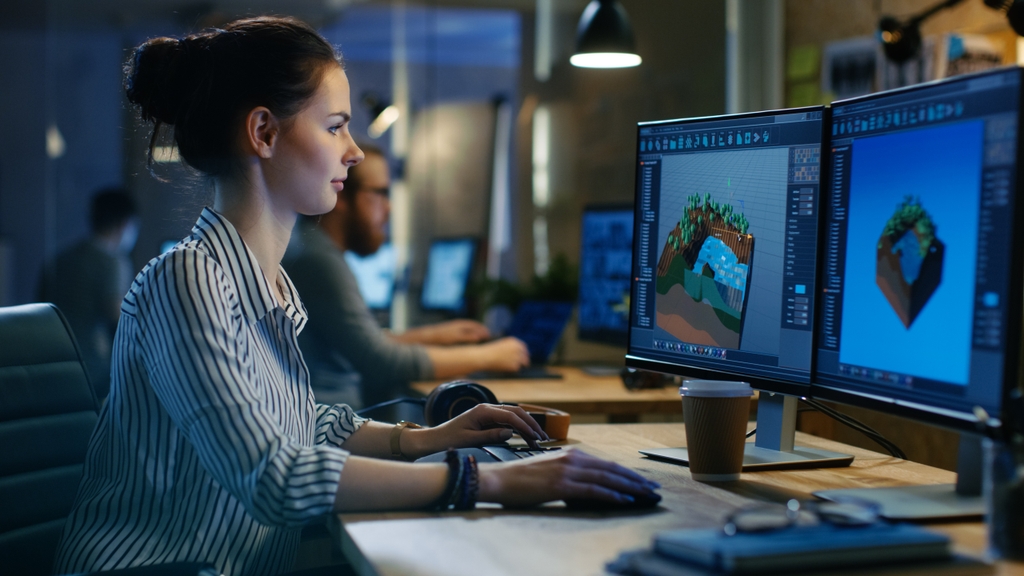 Online Graphic Design Courses: woman working on game graphics on a computer.